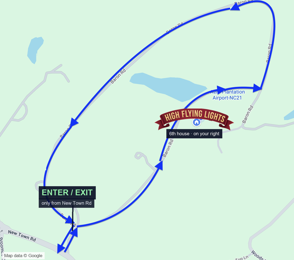 Map of the one-way traffic flow: enter from New Town Road, drive up the east side of the Baron Road loop past High Flying Lights (sixth house, on your right), around the top, and back down the west side to exit at the same entrance.